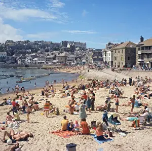 Holidaymakers on the harbour beach, St Ives, Cornwall
