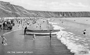 Images Dated 11th August 2011: Holidaymakers on the sands at Filey, North Yorkshire