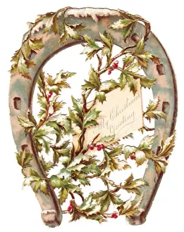 Holly and horseshoe on a Christmas card