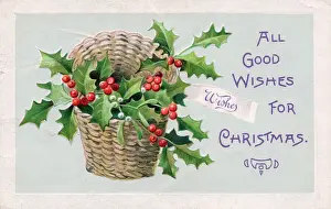 Holly and mistletoe in a basket on a Christmas postcard