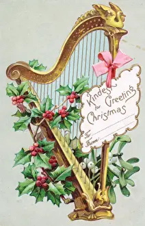 Holly, mistletoe and harp on a Christmas postcard