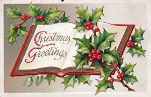 Holly and open book on a Christmas postcard