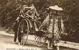 Hong Kong, China - Rickshaw driver wearing leaf raincoat