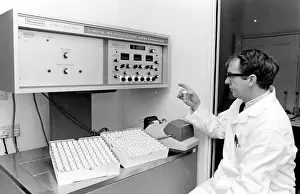 Horse doping tests -- a laboratory technician in a white coat sits in front of a Packard