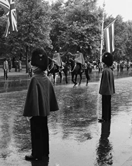 Mall Gallery: Horse Guards ride along The Mall in rain, London