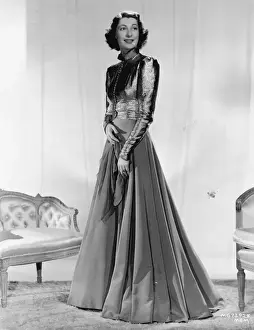 Metro Goldwyn Mayer Prints: A hostess gown designed by Dolly Tree, for Ilka Chase