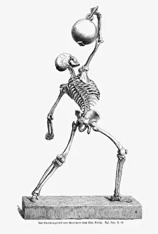 Human skeleton holding a heavy object