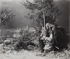 Hunters with guns out shooting in the snow, Canada