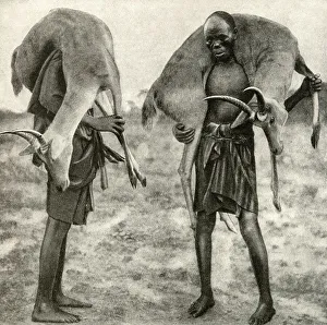 Images Dated 7th August 2018: Huntsmen with game, Tanganyika, East Africa