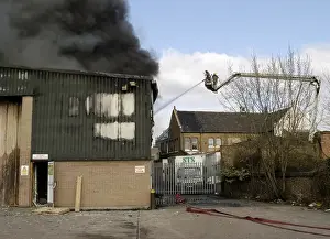 Platforms Prints: A hydraulic lift in action at scene of fire, Penge