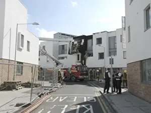A hydraulic lift vehicle at the scene of a fire