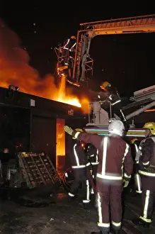 Hydraulic platform at work on fire at commercial premises