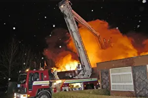Hydraulic platform at work on fire at commercial premises