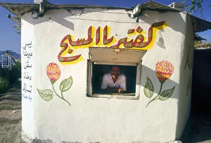 Salesman Collection: Ice cream man in kiosk, Aqaba, Jordan