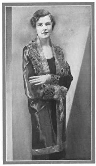 Deep Collection: Illustration of a lady wearing an elegant evening coat, with deep embroidery on the collar