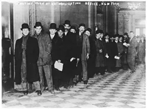 Await Gallery: Immigrants arriving at Ellis Island, New York
