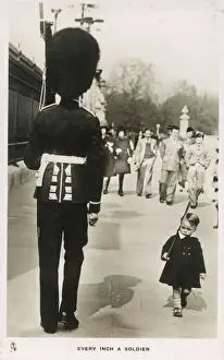 Every Inch a Soldier - A youn boy marches past a Guardsman in proud imitation