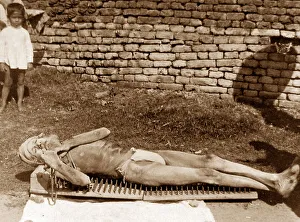 India - Calcutta - doing penance on a bed of spikes