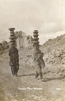 India - Women carrying milk on their heads