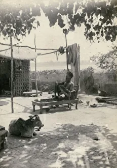 Indian fakir or holy man lying on a bed of nails, India