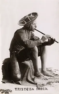 Indian man playing the flute, India