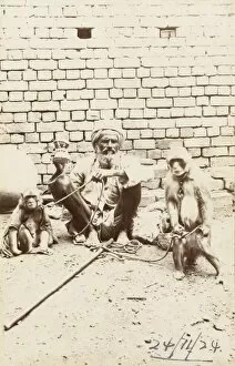 Indian Street Entertainer with two monkeys