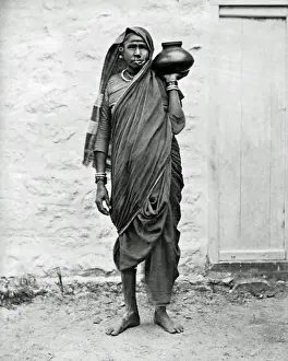 Indian woman carrying a jar