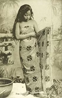 Images Dated 20th April 2011: Indonesia - Java - Young girl puts on sarong