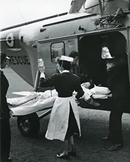 Suffering Prints: Injured boy loaded into a Westland Whirlwind