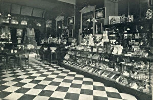 Interior of what is described as a high class confectioners tea room with a counter