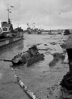 Some invasion craft and a tank submerged Some invasion craft and a tank submerged
