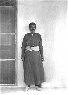 Iranian man with a gun in his belt