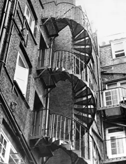 Spiral Prints: An iron spiral staircase, probably used as a fire escape. Date: 1950s