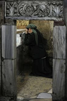 Images Dated 5th January 2014: Israel. Jerusalem. Tomb of the Virgin Mary. Woman praying