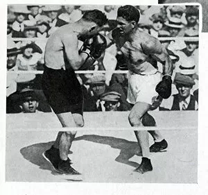 Images Dated 21st September 2018: Jack Dempsey and Tommy Gibbons in a boxing match