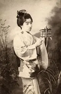 Japan - Geisha with crickets in a small cage