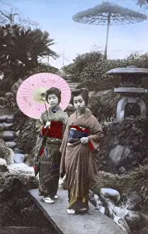 Courtesan Prints: Japan - Two Geisha Girls - pose in an ornamental garden