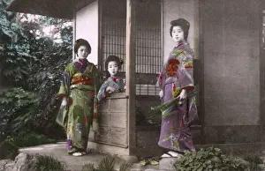 Courtesans Prints: Japan - Three Geisha pose for the photographer by a house