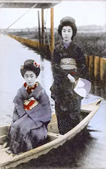 Courtesan Prints: Japan - Two Japanese Geisha Girls pose on a small boat