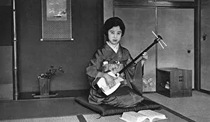 Alcove Gallery: Japan - Music Teacher playing a Shamisen