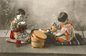 Eats Gallery: Japan - Two young Children eating rice and drinking tea