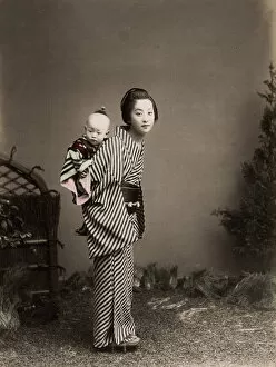 Lifestyle Collection: Japan - young nurse carrying a baby