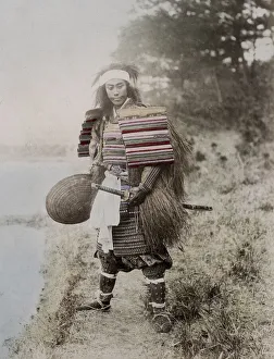 Japanese actoras a samurai, armour, two swords, grass coat