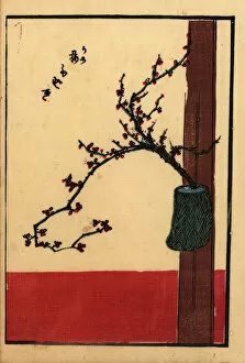 Japanese flower arrangement with plum in a vase on a beam