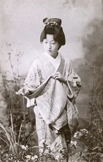 Examining Prints: Japanese Geisha examining some plants