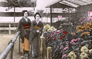 Courtesans Prints: Two Japanese Geisha in a garden with colourful blooms