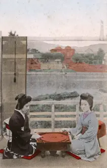 Courtesan Prints: Two Japanese Geisha girls playing crokinole