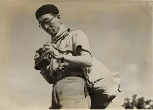 Backpack Prints: Japanese leader with camera at cub conference