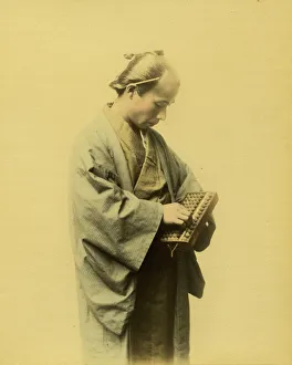 Abacus Gallery: Japanese man counting on an abacus