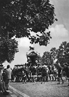 Borne Prints: Japanese men carry a Shinto Mikoshi portable shrine